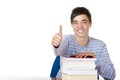 Happy male student with study books show thumb up Royalty Free Stock Photo