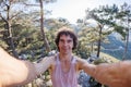 Happy male tourist takes a selfie in the forest. A man takes a selfie on the street. An influential travel blogger enjoys a trip