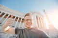 Happy male tourist taking selfie photo on background Venice Square in Rome Italy, blue sky. Travel concept Royalty Free Stock Photo