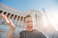 Happy male tourist taking selfie photo on background Venice Square in Rome Italy, blue sky. Travel summer concept Royalty Free Stock Photo