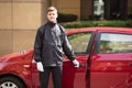 Happy Male Valet Opening Car Door