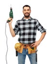 Happy male worker or builder with drill and tools Royalty Free Stock Photo