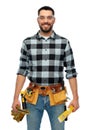 Happy male worker or builder with tools and level Royalty Free Stock Photo