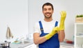 happy male worker or cleaner in gloves at kitchen Royalty Free Stock Photo