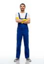 happy male worker or cleaner in overal and gloves Royalty Free Stock Photo