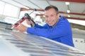 Happy male worker fixing caravan Royalty Free Stock Photo