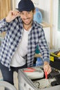 happy male worker fixing washing machine Royalty Free Stock Photo