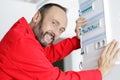 happy male working on fusebox Royalty Free Stock Photo