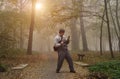 Happy man in the autumn forest Royalty Free Stock Photo