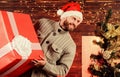 Happy man with beard santa hat. present for you. only my. advantageous offer of winter discounts. christmas shopping