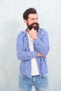 Happy man with bearded smile on unshaven face and stylish hair in casual fashion style, salon