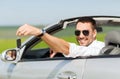 Happy man in cabriolet showing car key Royalty Free Stock Photo