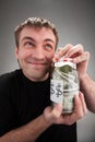 Happy man with canned money Royalty Free Stock Photo