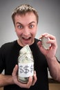 Happy man with canned money Royalty Free Stock Photo