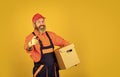 happy man cardboard box. carrying boxes inside the building. unpacking moving boxes. new house at moving day. Man Royalty Free Stock Photo