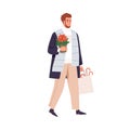 Happy man carrying Christmas plant, poinsettia in pot and shopping bag with Xmas gifts. Person going, walking outdoors