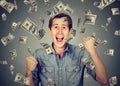 Happy man celebrates success under money rain Royalty Free Stock Photo