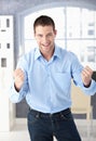 Happy man celebrating success smiling Royalty Free Stock Photo