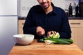 Happy man chopping vegetables Royalty Free Stock Photo