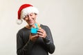 Happy man in Christmas hat with gift box. Winter and christmas holidays. Christmas sale. Surprised man opened christmas present Royalty Free Stock Photo