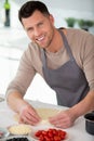 happy man cooking pizza at home Royalty Free Stock Photo