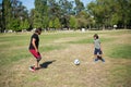 Happy man with disability playing football with son Royalty Free Stock Photo