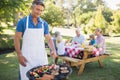 Happy man doing barbecue for his family Royalty Free Stock Photo