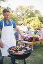 Happy man doing barbecue for his family Royalty Free Stock Photo