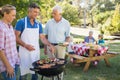 Happy man doing barbecue for his family Royalty Free Stock Photo