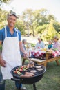 Happy man doing barbecue for his family Royalty Free Stock Photo