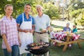Happy man doing barbecue for his family Royalty Free Stock Photo