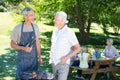 Happy man doing barbecue with his father Royalty Free Stock Photo