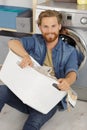 Happy man doing laundry Royalty Free Stock Photo