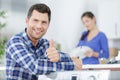 Happy man doing thumbs up in kitchen Royalty Free Stock Photo