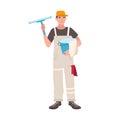 Happy man dressed in uniform standing and holding bucket and cleaning wiper. Male window cleaner, housekeeping service Royalty Free Stock Photo