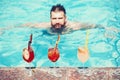 Happy man drink cocktail at the pool. Summer holiday idyllic Royalty Free Stock Photo