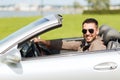 Happy man driving cabriolet car outdoors Royalty Free Stock Photo