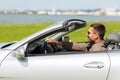 Happy man driving cabriolet car outdoors Royalty Free Stock Photo