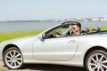 Happy man driving cabriolet car outdoors Royalty Free Stock Photo