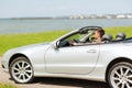 Happy man driving cabriolet car outdoors Royalty Free Stock Photo