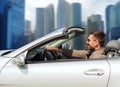 Happy man driving cabriolet car outdoors Royalty Free Stock Photo