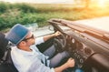 Happy Man driving cabriolet car by province mountain road top view imaage