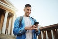 Happy man, earphones or phone on university, school or college campus on social media, education podcast or learning Royalty Free Stock Photo