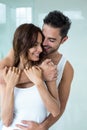 Happy man embracing beautiful wife