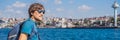 Happy man enjoying the sea from ferry boat crossing Bosphorus in Istanbul. Summer trip to Istanbul BANNER, LONG FORMAT Royalty Free Stock Photo