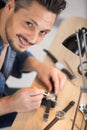 happy man fixing mechanical watch Royalty Free Stock Photo