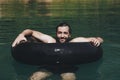 Happy man floating around in the water Royalty Free Stock Photo