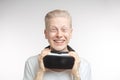 Happy man getting experience using VR headset glasses of virtual reality, isolated on white background Royalty Free Stock Photo
