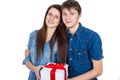 Happy Man giving a gift to his Girlfriend. Happy Young beautiful Couple isolated on a White background. Royalty Free Stock Photo