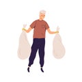 Happy man in gloves carrying trash bags with collected garbage. Eco volunteer holding packed litter after cleaning Royalty Free Stock Photo